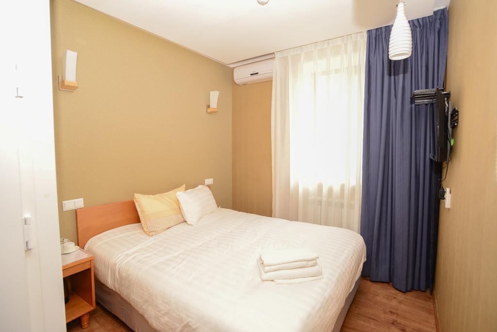 ホテル Grushevy Hospitality Boutique アルマトイ 部屋 写真